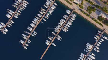 Photo for Aerial top view of boats and yachts in modern marina. Embankment of resort town, view from above. Mediterranean sea, Turkey. - Royalty Free Image