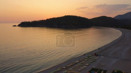Photo for Tropical beach landscape at sunset. Beautiful nature scenery. Aerial panoramic view from above. - Royalty Free Image