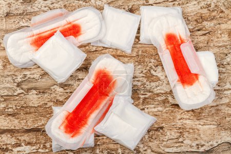 Photo for Pile of used sanitary pads with blood. Menstruation and feminine hygiene concept. - Royalty Free Image