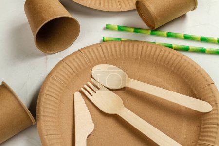 Photo for Top view eco paper craft plate and utensils. Fork with knife and spoon. - Royalty Free Image