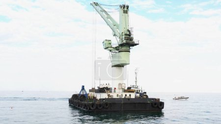 Foto de Floating marine crane in Odessa Black Sea. Offshore crane for loading goods in dry bulk cargo ships. - Imagen libre de derechos