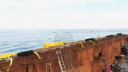 Foto de Deck of an old rusty tanker. Sunken ship in the sea. - Imagen libre de derechos