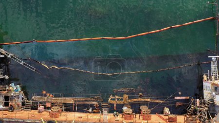 Photo for Top view of the deck of the sunken ship. The collapse of an oil tanker. Pollution of the World Ocean. - Royalty Free Image