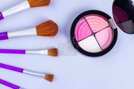 Photo for Set of large cosmetic brushes and round powder box. Top view flat lay. - Royalty Free Image