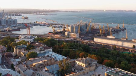 Téléchargez les photos : Aerial drone view of sea port with tower cranes. Ukraine Odessa cityscape. - en image libre de droit