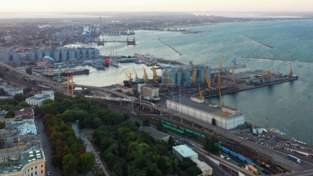 Téléchargez les photos : Aerial view of Odessa city scape with sea port. Urban indastrial and marine scape from drone. - en image libre de droit