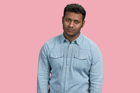 Photo for Portrait of sad depressive young indian man. Isolated on pink. - Royalty Free Image