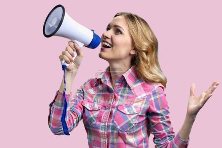Photo for Young blonde blue-eyed woman speaking in megaphone. Isolated on pink background. - Royalty Free Image