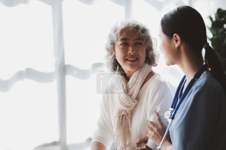 Photo for Doctors are talking to explain medication and health care to elderly patients, elderly people with underlying diseases need to be closely monitored by doctors and relatives. caring for the elderly. - Royalty Free Image