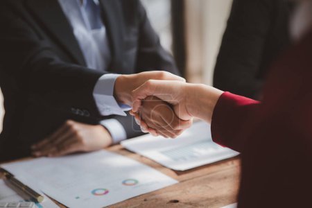 Photo for Business investor group handshake, Two businessmen are agreeing on business together and shaking hands after a successful negotiation. Handshaking is a Western greeting or congratulation. - Royalty Free Image