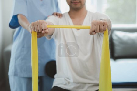 Photo for Physiotherapist is doing physical therapy for a patient, the patient has body aches due to overwork and has undergone treatment and physiotherapy with a professional physiotherapist. - Royalty Free Image