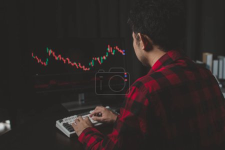 Photo for Stock investor with stock market graph screen, stock fluctuation analysis, business man trading stocks for profit, stock market fluctuation graph screen, profit trading analysis. - Royalty Free Image