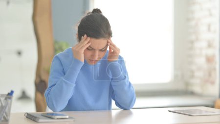 Photo for Tired Indian Woman with Headache at Work, Migraine - Royalty Free Image