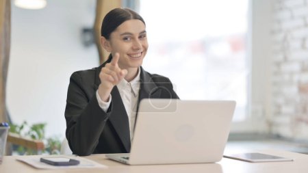 Photo for Young Businesswoman Pointing Finger at Camera at Work - Royalty Free Image