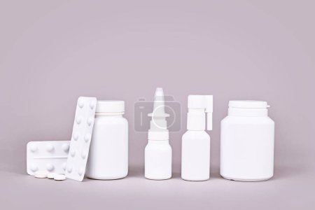 Medication for cold and flue. Nasal spray, throat spray, pills and tissues 