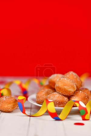 Small German traditional 'Berliner Pfannkuchen', a donut without hole filled with jam. Traditional served during carnival