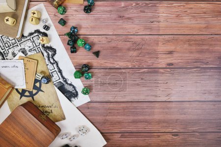 Photo for Tabletop role playing flat lay with colorful RPG dices, rule books and notes on wooden background with copy space - Royalty Free Image