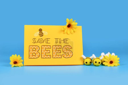 Guardar el signo de las abejas con las abejas de fieltro y flores amarillas