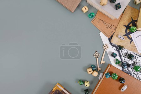 Tabletop role playing flat lay background with RPG dices, rule books, dungeon map with copy space