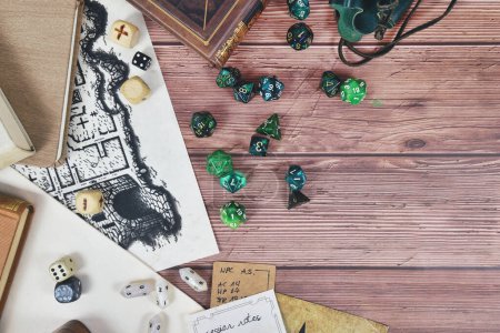 Photo for Tabletop role playing flat lay background with colorful RPG dices, rule books and notes on wooden background with copy spac - Royalty Free Image