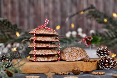 Stacks of traditional German round glazed gingerbread Christmas cookie called 'Lebkuchen' with seasonal decoration