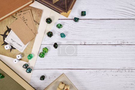 Photo for Tabletop role playing flat lay background with RPG dices, rule books, dungeon map on white wooden background with copy space - Royalty Free Image