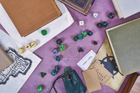 Photo for Tabletop role playing flat lay background with colorful RPG dices, notes, rule books and dungeon map - Royalty Free Image