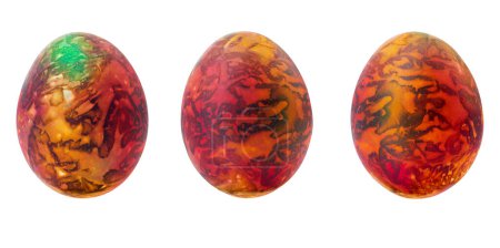 Téléchargez les photos : Collection of abstract orange - brown - green drawings on painted eggs. Easter concept, fantasy animal eggs. Copy space - en image libre de droit
