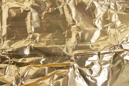 Photo for Gold shiny gradient crumpled background. Abstract foil. Holiday, wealth - Royalty Free Image