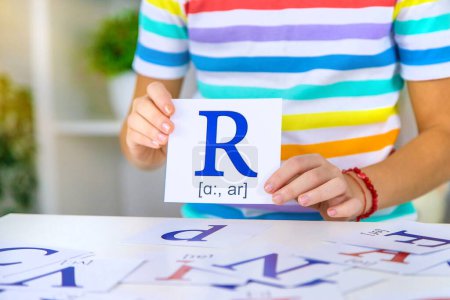 Photo for The child learns English letters. Selective focus. Kid. - Royalty Free Image