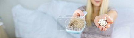 Photo for A woman's hair falls out vitamins. Selective focus. People. - Royalty Free Image