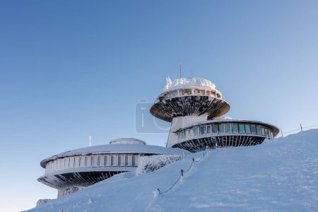 Winter morning, disc shaped meteorological observatory in snezka, mountain on the border between Czech Republic and Poland.