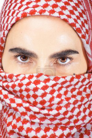 Photo for Woman's Portrait with a Kufiya Veiling the Face - Royalty Free Image