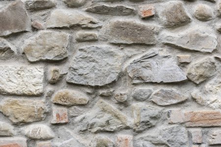 Stone wall background and ancient tuff, Tuscany in ItalyStone wall background and ancient tuff, Tuscany in Italy