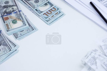 Photo for Stack of money spread on table, representing budget or savings. - Royalty Free Image