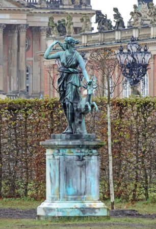 Photo for Potsdam, Germany- Nov 21 2017 Bronze statue of Hercules stands in front of the Roman Baths at Sanssouci. It's a copy of a famous Greek statue called the Farnese Hercules. - Royalty Free Image