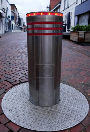 Photo for Coevorden, like many other cities in the Netherlands, has secured the main street against traffic with automatic traffic bollards with flashing lights - Royalty Free Image