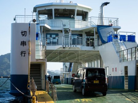 Photo for Hiroshima, Japan - August 24, 2018: Vehicles boarding the Etajima ferry bound for Kirikushi at Ujina terminal of Hiroshima port - Royalty Free Image