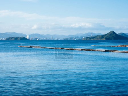 Scenic view of Hiroshima Bay and Hiroshima city skyline from Etajima island in Seto Inland Sea - Hiroshima prefecture, Japan