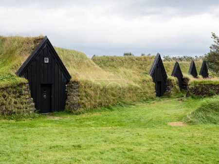 Photo for Traditional Icelandic turf houses at historic Keldur farm, one of the oldest turf houses in Iceland - Royalty Free Image