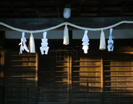 Shimenawa rope with shide paper streamers adorning a Japanese shinto shrine building