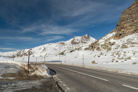Photo for Julier pass, Switzerland, February 21, 2023 Alpine winter wonderland on the top of the Julier pass street on a sunny day - Royalty Free Image
