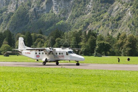 Photo for Mollis, Switzerland, August 18, 2023 C-FPSH Dornier 228-202 aircraft is taxiing on the runway - Royalty Free Image
