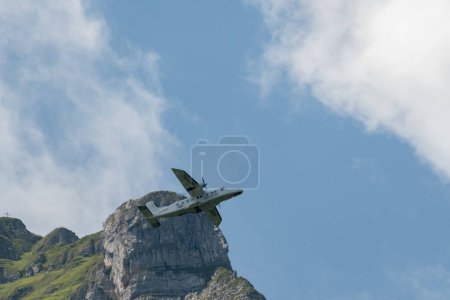 Photo for Mollis, Switzerland, August 18, 2023 C-FPSH Dornier 228.202 aircraft during an air show in the alps - Royalty Free Image