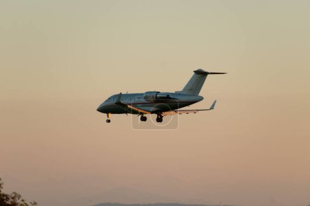 Photo for Zurich, Switzerland, September 6, 2023 9H-VFE Vista Jet Malta Bombardier Challenger 605 aircraft on its final approach to runway 14 in the evening - Royalty Free Image