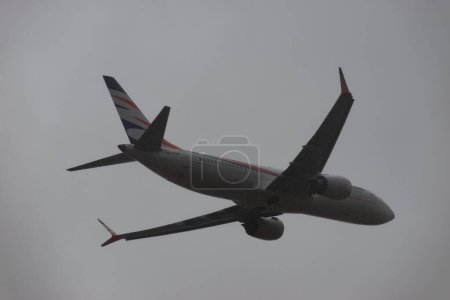 Photo for Zurich, Switzerland, January 4, 2024 OK-SWM Smartwings Boeing 737-8 Max aircraft is taking off from runway 32 during a rain shower - Royalty Free Image