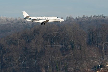 Photo for Zurich, Switzerland, January 14, 2024 YU-SPB Air Pink Cessna 560XL Citation XLS aircraft on its final approach to runway 14 during the world economic forum in Davos - Royalty Free Image