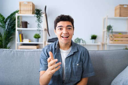 Photo for Camera point of view of hispanic teenager boy live streaming or having video conference. - Royalty Free Image