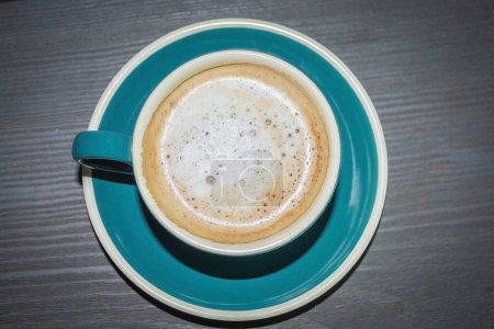 Photo for A mug of coffee in a cafe. A hot drink in a mug. Coffee in a coffee shop - Royalty Free Image