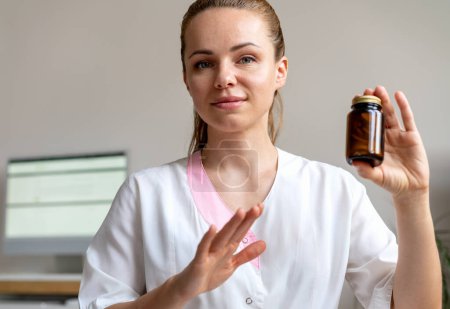 Pharmaceutical company representative demonstrates new drugs during a web conference. Telemedicine concept.